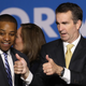 Gov.-elect Ralph Northam (R) and Lt. Gov.-elect Justin Fairfax greet supporters at an election night rally November 7, 2017 in Fairfax, Virginia.